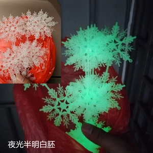 Glow-in-the-dark snowflake ornaments for Christmas decor, showing luminous effect in dark