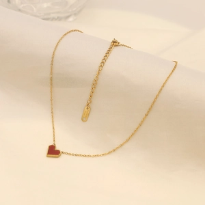 Detailed close-up of 18k gold-plated stainless steel chain with red heart pendant