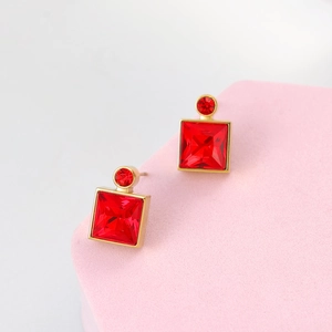 Elegant gold square red crystal earrings on pink display stand minimalist jewelry