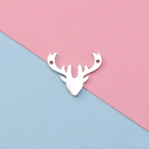 Close-up of silver deer head stainless steel pendant with double holes for DIY jewelry