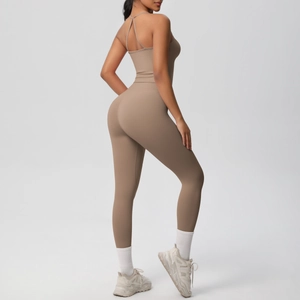 Rear view of brown yoga set showing high-waisted leggings and slim straps top