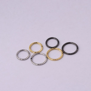 Three pairs of textured stainless steel hoop earrings in gold, silver and black finishes