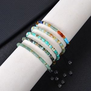 Bohemian adjustable 4mm natural stone beaded bracelets with lapis and agate on display
