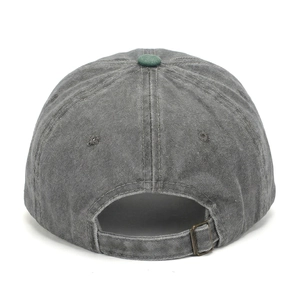 Detail of adjustable metal buckle and washed cotton texture on vintage baseball cap