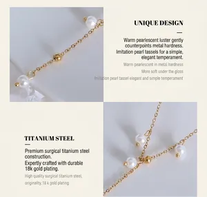 Macro detail of 18K gold plated titanium steel necklace with elegant pearl tassels