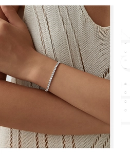 Close-up of a S925 sterling silver tennis bracelet with round cubic zirconia on a wrist