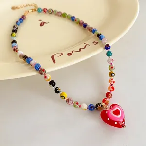 Colorful Millefiori beaded necklace featuring a red heart pendant and gold lobster clasp