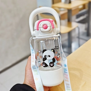 Close-up of a cartoon panda water bottle with pink handle and a portable shoulder strap