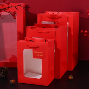 Red paper gift bags with clear window and rope handles in various sizes for holiday flowers
