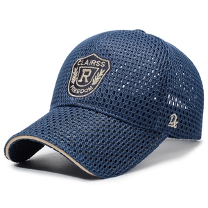 Navy blue breathable mesh baseball cap with embroidered shield patch and curved brim