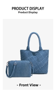 Front view of blue denim woven tote bag and shoulder bag set with metallic hardware