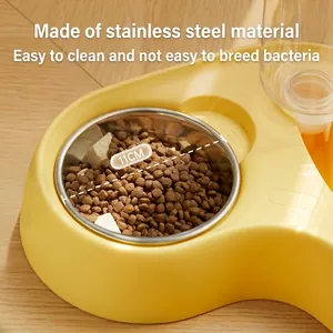 Dual pet feeder with 11cm stainless steel bowl and transparent water tank in bright yellow