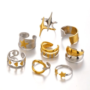 Set of 8 gold and silver star and heart stainless steel rings in varied textures