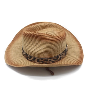Detail of woven straw cowboy hat with leopard print band and adjustable chin cord