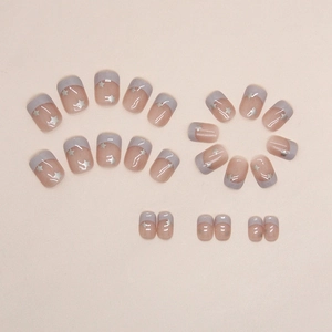 Short French aurora star press-on nails in dusty pink with silver star designs