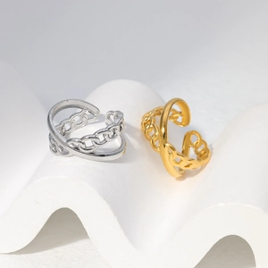 Detail of interlocking chain design on adjustable gold and silver stainless steel rings