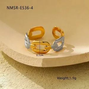 Detail of two-tone chain ring with 0.7cm width and 1.9g weight on stone background