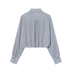 Back view of blue and white gingham cropped shirt with puff sleeves and pleated details
