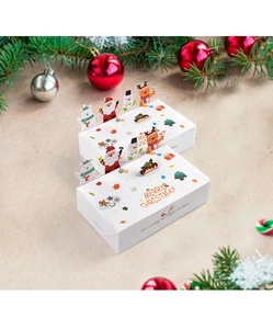 Detail of white Christmas folding gift boxes with reindeer and Santa Claus illustrations