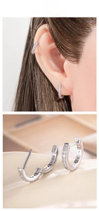 Detail of silver plated hoop earrings with cubic zirconia on model and close-up view