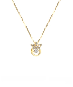 Detailed macro view of gold-plated crown necklace with dancing cubic zirconia heart pendant