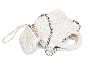 Detail of hand-woven leather texture on a white bucket bag with a metal chain strap