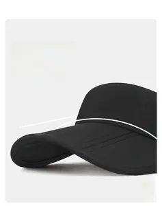 Detail view of the wide-brimmed black visor featuring quick-dry matte sport fabric