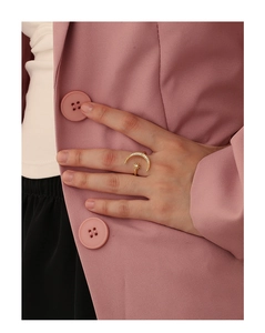 Detail of gold star and moon ring with cubic zirconia worn on a finger