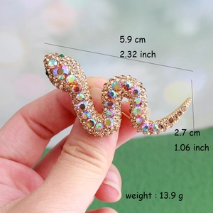 Detailed view of snake brooch measurements showing 5.9cm length and crystal accents