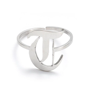 Detail view of gothic style letter T engraving on adjustable stainless steel ring