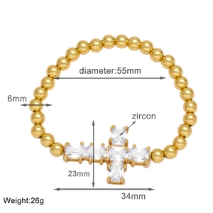 Detail view of 6mm gold bead bracelet with zircon cross pendant and size dimensions