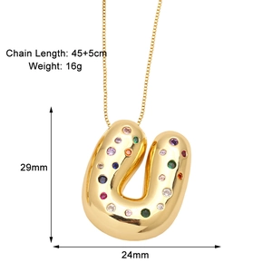 Detail view of gold balloon letter U pendant necklace with colorful stones and dimensions