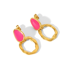 Macro detail of Bohemian 18K gold plated earrings with vibrant rose pink enamel accents