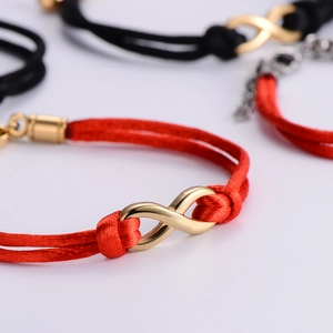 Infinity symbol braided rope bracelets in red and black with gold titanium steel pendants