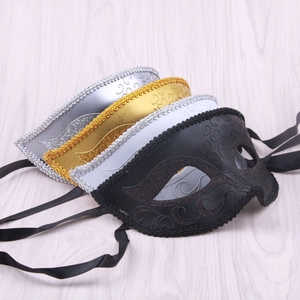 Detail of four colorful retro jazz half-face masks with embossed patterns for Halloween