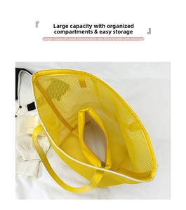 Detail view of the yellow mesh beach bag interior with a functional zipper pocket