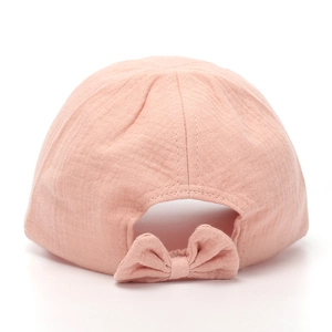 Detailed back view of a pink cotton girl's sun hat featuring a cute decorative bow
