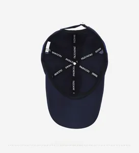 Detailed interior of navy baseball cap featuring breathable laser-cut holes and reinforced seams