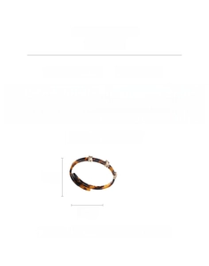 Detail view of leopard resin bangle with gold clasp, 6.5cm diameter and 0.8cm width