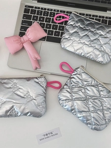 Quilted silver metallic mini storage pouches with heart and bow patterns and pink loops