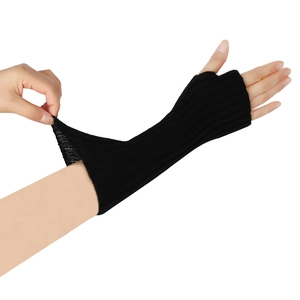 Detail of black knitted arm warmer showing high elasticity and thumb hole design