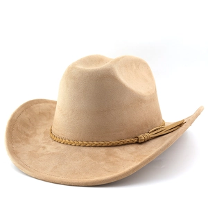 Detail of camel suede western cowboy hat with woven band and tassel decoration