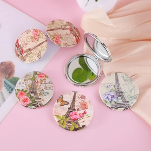 Vintage Eiffel Tower round folding makeup mirror with retro floral patterns on pink silk