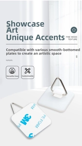 Detail view of 3M adhesive backing and stainless steel triangular hook for plates