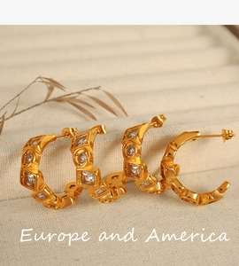 Detailed close-up of 18K gold plated hoop earrings with square and round clear zircons