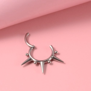 G23 titanium nose hoop ring with spikes and beads decoration on pink background