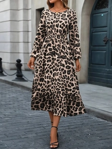 Detail of leopard print maxi dress featuring elastic waist and ruffle hem design