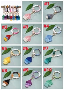 Detailed grid of silicone bead keychains showing sizes, tassels, and 10 color variants
