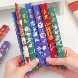 Close-up of Lucky Bear blind box pens with colorful packaging and inspirational quotes