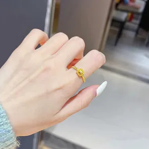 Elegant gold beaded twisted band ring featuring a square sparkling centerpiece for women